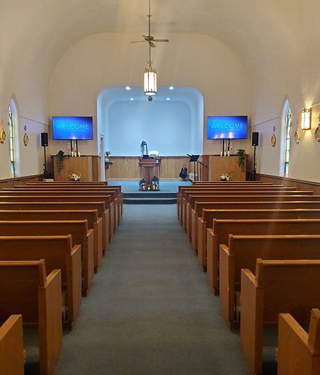 Sanctuary aisle and pews facing the pulpit